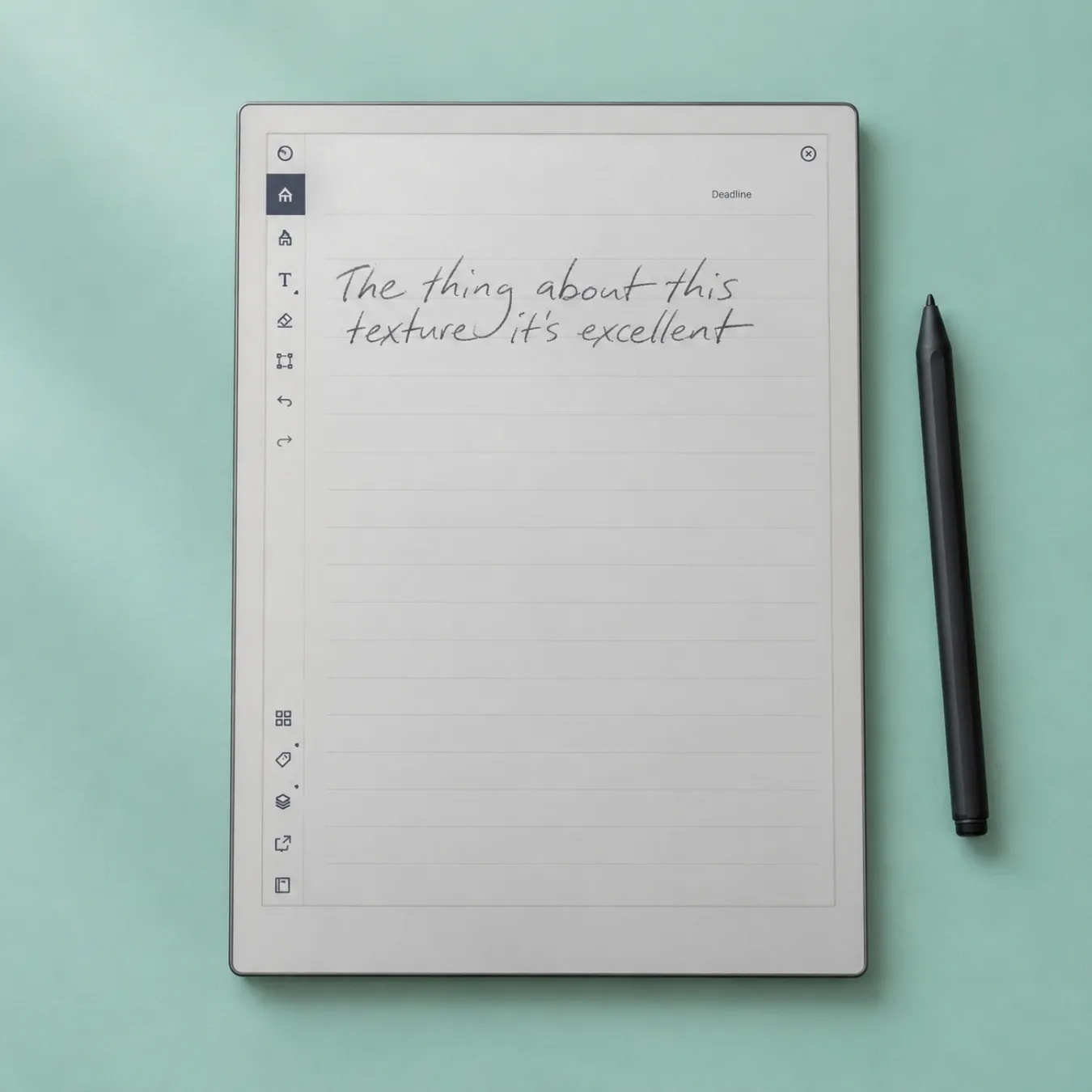 reMarkable Paper Pro on a mint green background with its stylus
