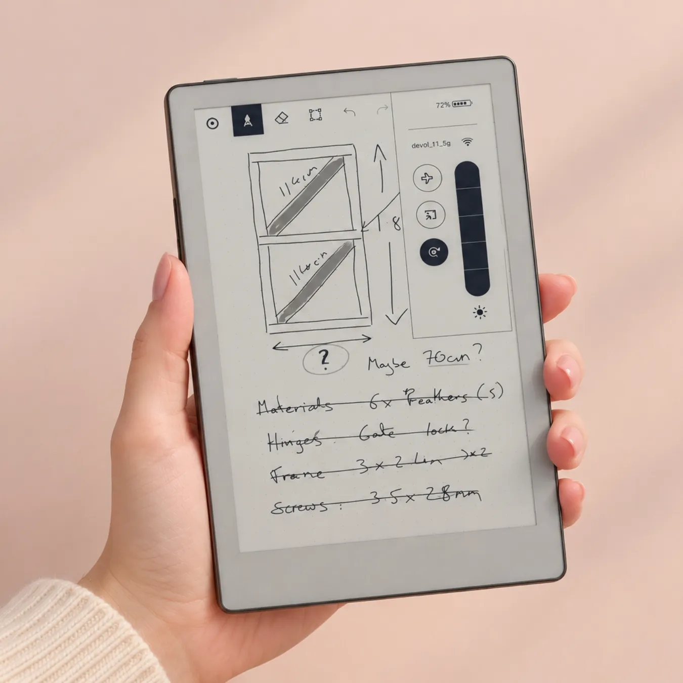 reMarkable Paper Pro Move held in one hand, with handwritten notes